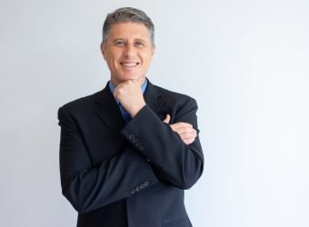 portrait-of-positive-confident-businessman-scaled-1